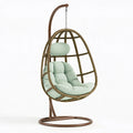 Fauteuil suspendu 105 x 105 x 195 cm en rotin brun avec coussin vert pour intérieur style bohème